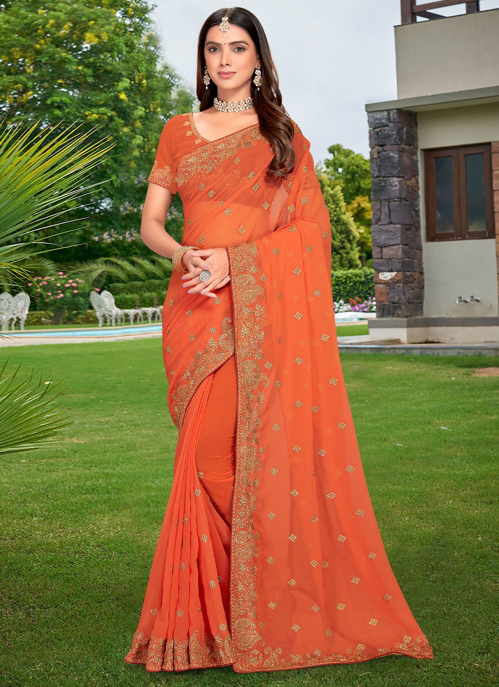 Charming Peach Georgette Embroidered Traditional Saree for Engagement