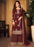 Faux Georgette Designer Palazzo Salwar Suit in Maroon Enhanced with Embroidered - 1
