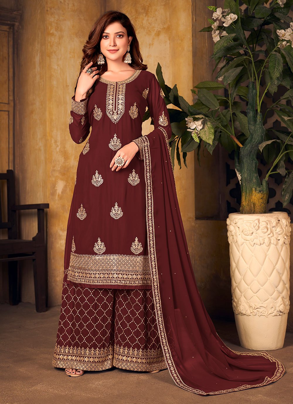 Faux Georgette Designer Palazzo Salwar Suit in Maroon Enhanced with Embroidered