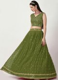 Faux Georgette Lehenga Choli in Green Enhanced with Embroidered - 1