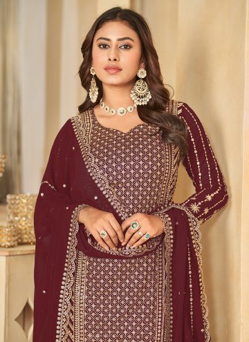 Faux Georgette Trendy Salwar Kameez in Maroon Enhanced with Embroidered
