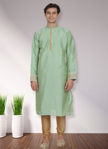 Green color Art Dupion Silk Kurta Pyjama with Patchwork