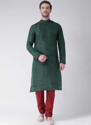 Green color Art Dupion Silk Kurta Pyjama with Plai