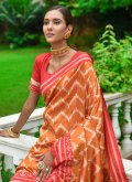 Handloom Silk Designer Saree in Orange Enhanced with Woven - 1