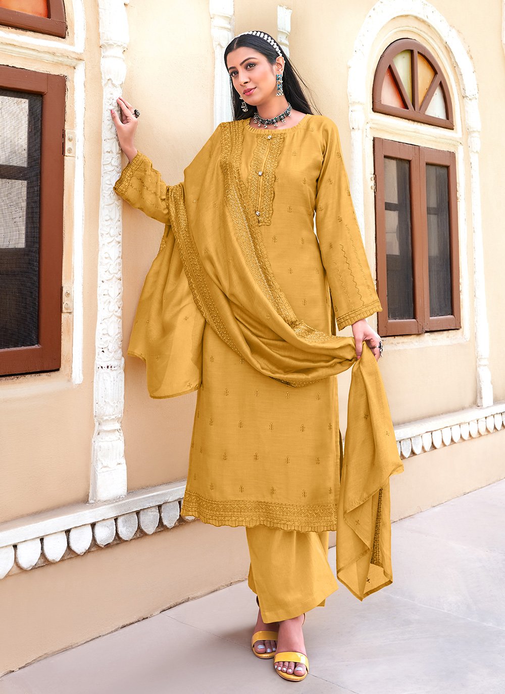 Muslin Designer Pakistani Salwar Suit in Yellow Enhanced with Embroidered