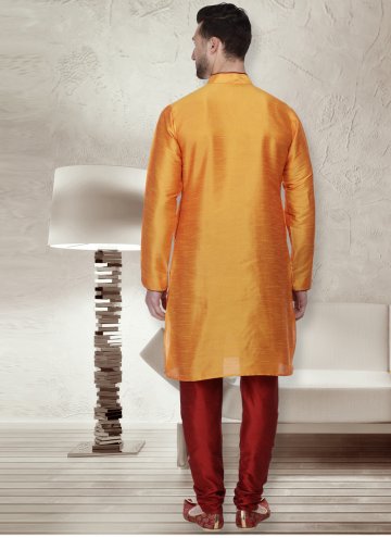 Orange color Art Dupion Silk Kurta Pyjama with Patchwork