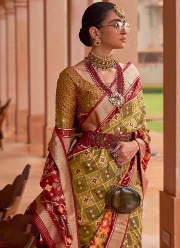 Patola Silk Designer Saree in Green Enhanced with Border