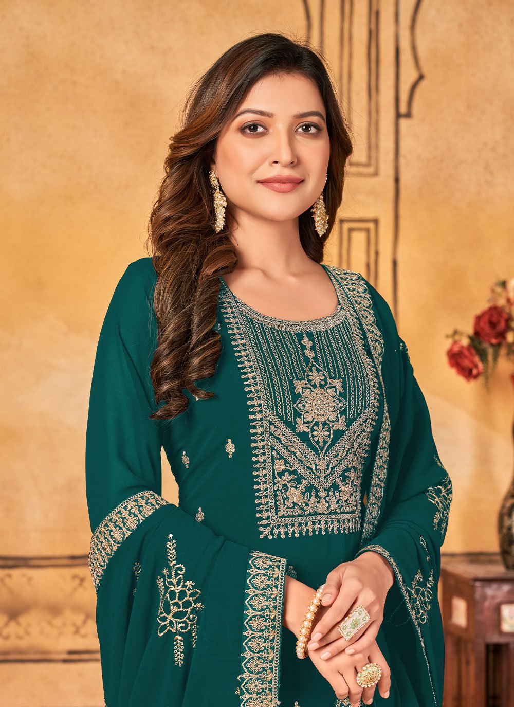 Teal color Faux Georgette Pant Style Suit with Embroidered