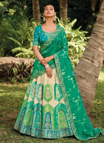 Cream and Green color Banarasi A Line Lehenga Choli with Embroidered
