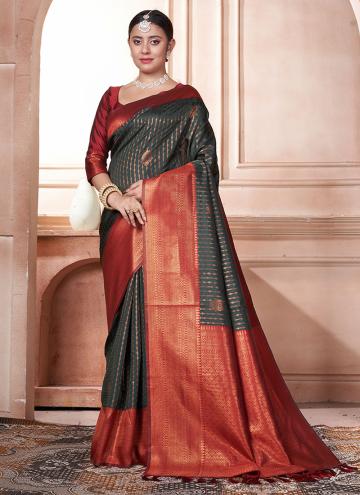 Kanjivaram Silk Contemporary Saree in Green and Orange Enhanced with Woven